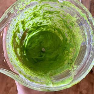 green cplor paste in a blender