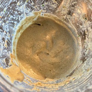 brown color chutney in a blender